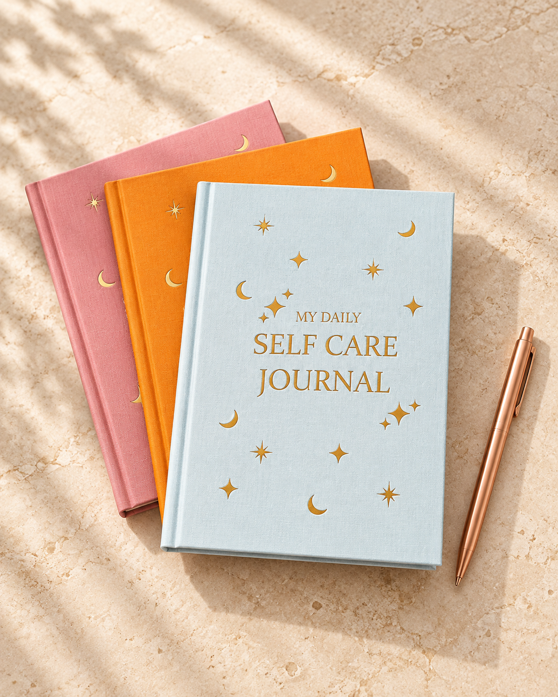 Celestial self-care journal trio with rose-gold pen