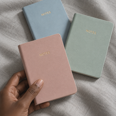 Pastel Mini Notes notebooks on cool grey fabric