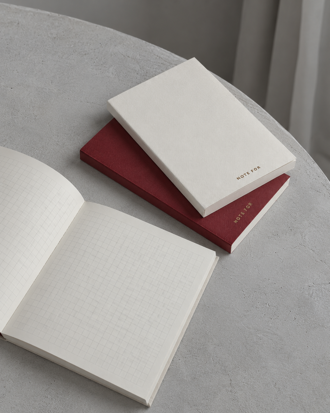 Red and ivory Note For notebooks with grid pages in cool natural light