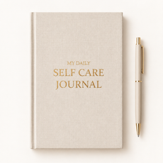 Minimalist beige self-care journal flat lay